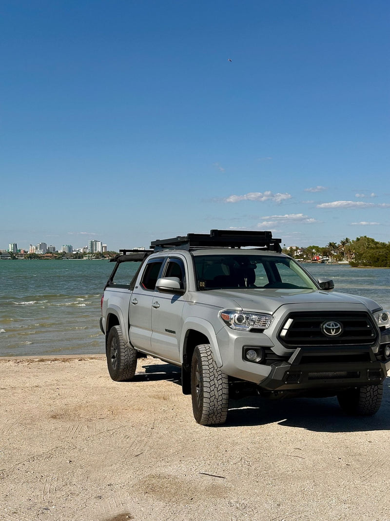 Uses his truck like a truck — Tanner W.'s Toyota Tacoma with a WildTop Nomad