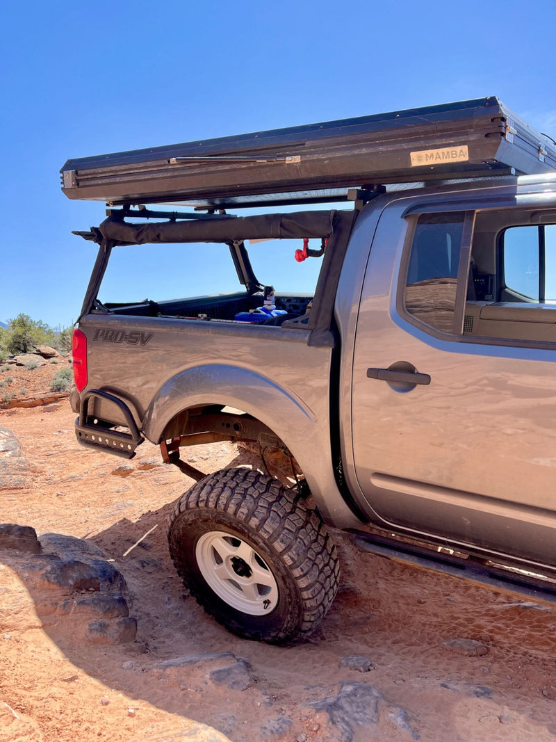 Rock-crawling stealth camper — Walter R.'s Nissan Frontier with a WildTop Nomad